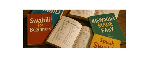 A messy pile of Swahili language learning books on a wooden table