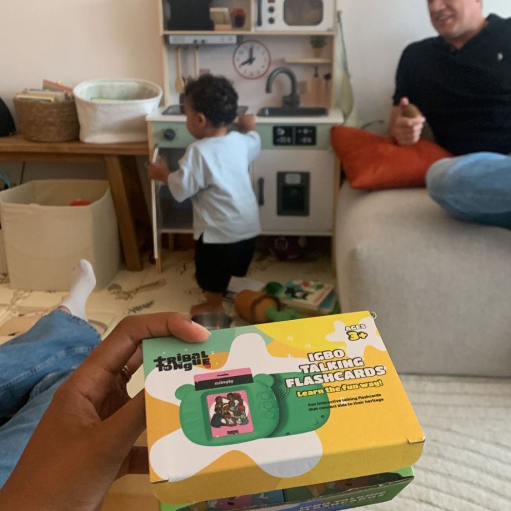 Family playing with Igbo Talking Flashcards